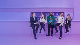 Five work collegues sitting at a bar banner light purple