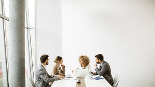 four-people-in-meeting