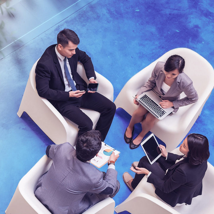 Four people sitting on chair