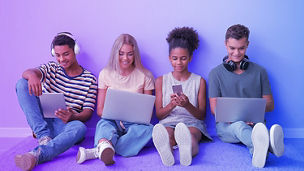 Four people using devices