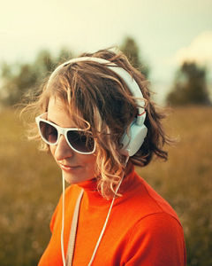 Woman wearing sunglasses and headphones