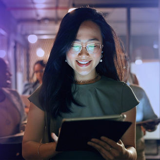 smiling woman with Ipad in an office