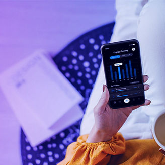Woman with smartphone and cup in hand