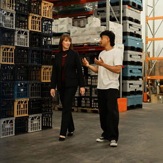 CFO of Messina Gelato and KPMG's Naomi Mitchell walking through warehouse and talking