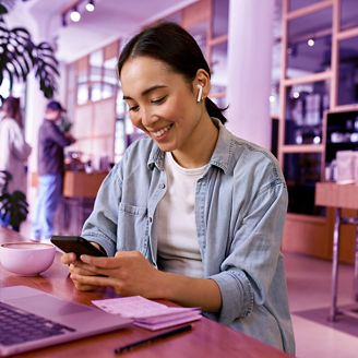 Young smiling Asian woman student using smartphone for elearning wearing earbud, watching online class webinar training in mobile app, studying, having hybrid remote video call on cell phone.; Shutterstock ID 2194984775; purchase_order: marketing advisory assurance; job: Anne rouschop; client: artificial intelligence