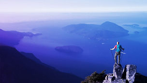 Man standing on mountain rock