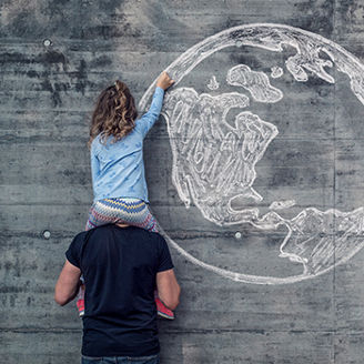 Girl drawing earth on wall
