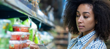 Girl fixing goods in store