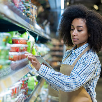 Girl fixing goods in store