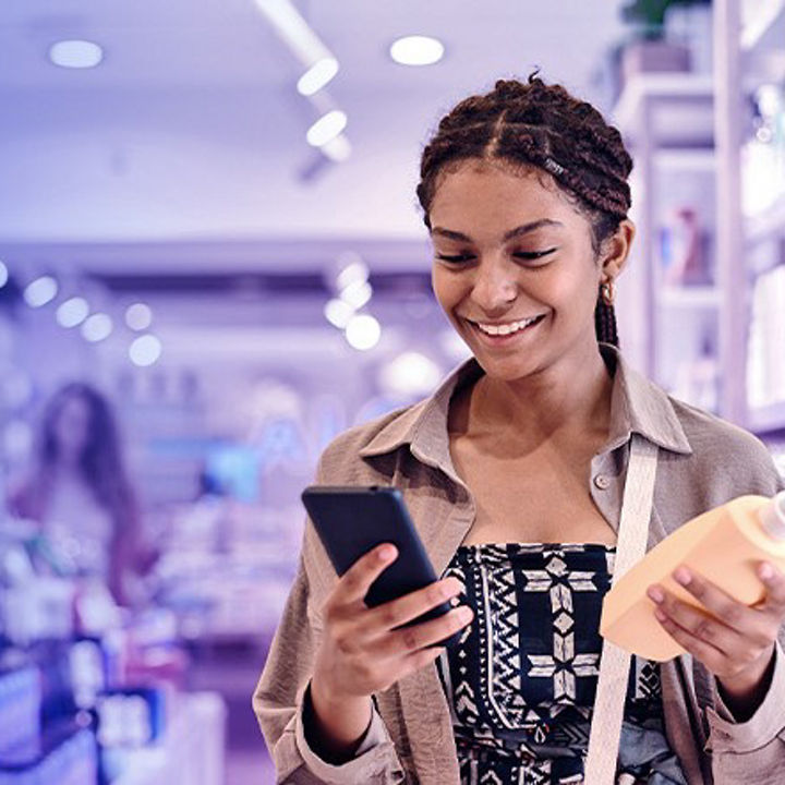 Girl holding phone and shampoo bottle banner