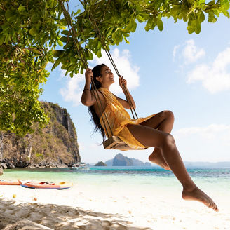 girl-swinging-on-beach