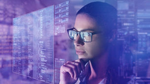 girl-wearing-specs-looking-at-statistics-on-smart-screen.jpg