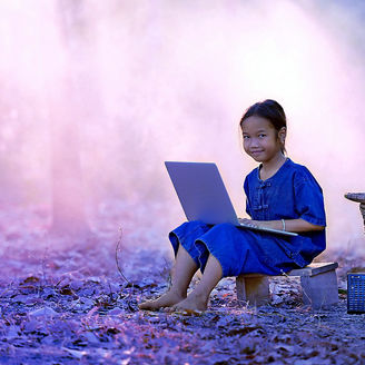 Girl with laptop in jungle