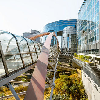 Glass bridge at front of glass building