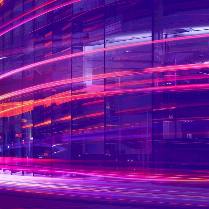 Glass building against blue pink laser lights