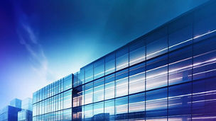 Glass building with glowing forescent lights inside
