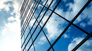 glass building with sky reflection