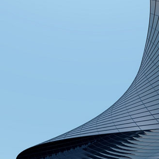 3D stimulate of high rise curve glass building and dark steel window system on blue clear sky background,Business concept of future architecture,lookup to the angle of the corner building.