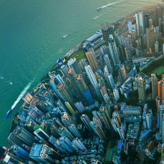 Little planet. Aerial view of Hong Kong Downtown. Financial district and business centers in smart city in Asia. Top view. Panorama of skyscraper and high-rise buildings.
