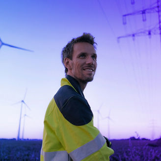 Man with windmill and energy tower