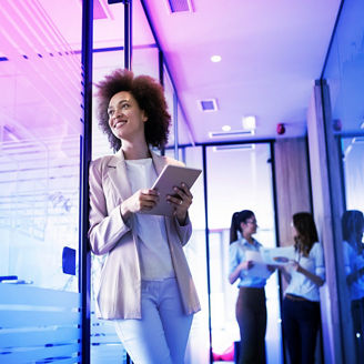 Portrait of a happy young black business woman smiling