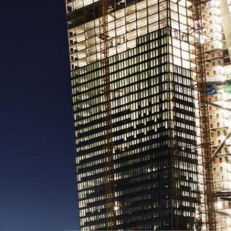 Highrise building with lights in night sky