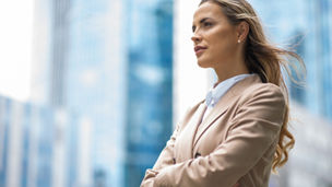 Portrait of a young beautiful businesswoman near her office