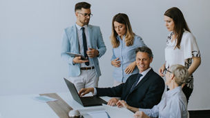 View at group of business people working together and preparing new project on a meeting in the office