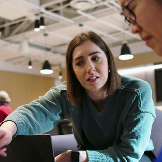 Woman explaining something to colleague