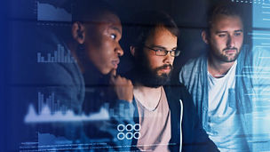 Group of people working on a digital screen
