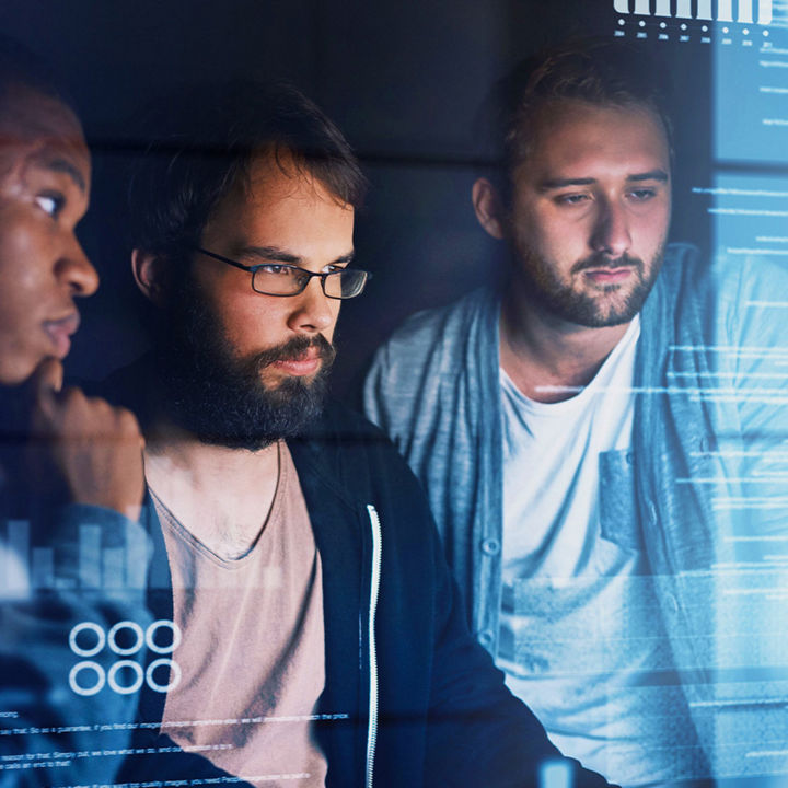 Group of people working on a digital screen