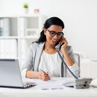 business, technology, communication and people concept - happy smiling businesswoman with papers calling on phone at office