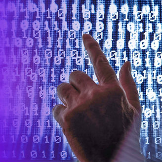 Hand in front of a digital screen