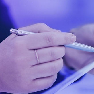 Hand holding a ballpoint pen