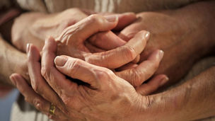 Hands holding each other
