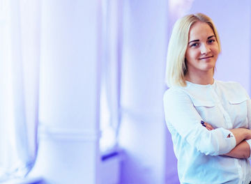 Smiling business woman against bright violet gradient background