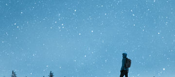 person standing on snow 