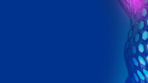 Woman sat down using her laptop with mountains in the distance