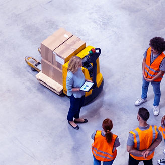 High angle view of warehouse workers meeting