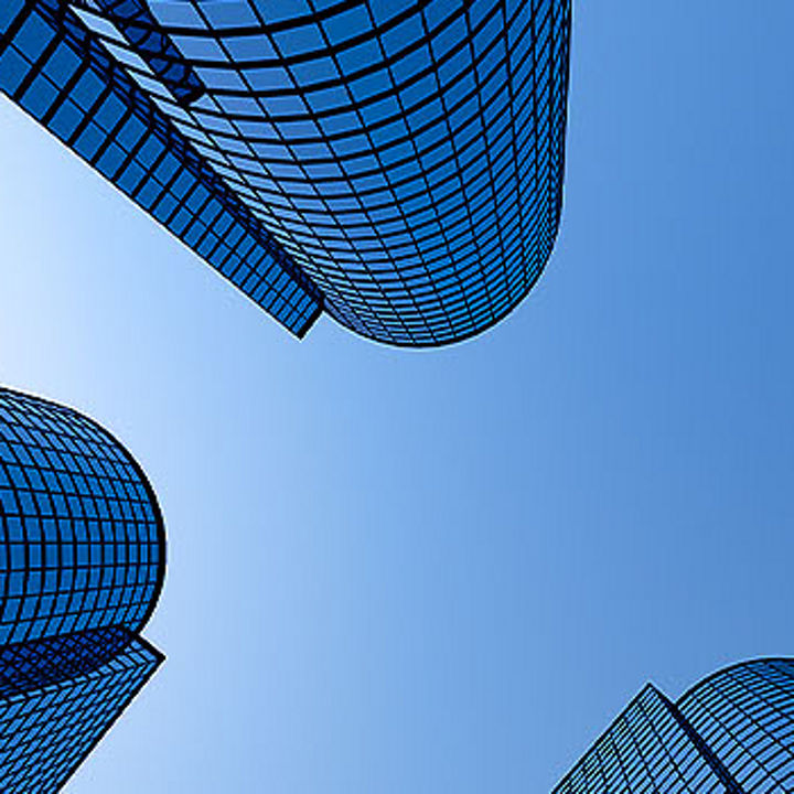 Glass façade and clouds
