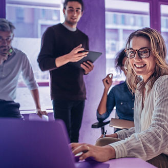 A team looking at laptop screen