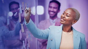 Woman in front of whiteboard
