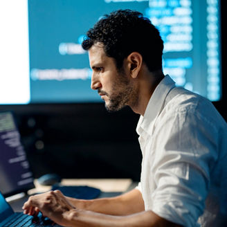 A male developer or tester is reviewing source code to ensure it adheres to programming guidelines and identify errors in specific functions or components. He is also verifying that the code meets all requirements, working at a startup technology office.