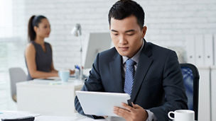 Close up man formalwear sitting office desk