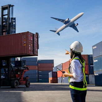 Foreman control loading Containers box to truck for Logistic Import Export Background, Business logistic concept, import and export concept.
