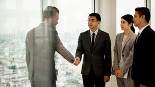 Business Partners Introductionary Handshake Bow