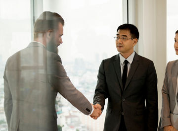 Business Partners Introductionary Handshake Bow