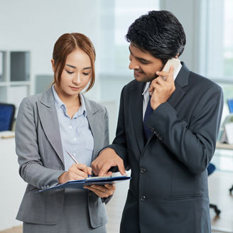 man in suit talking phone