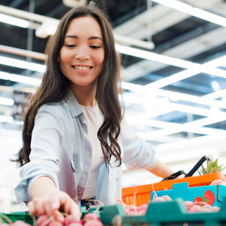smiling asian women picking radishes