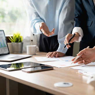 Team work process. Marketing strategy brainstorming. Paperwork and digital in modern office